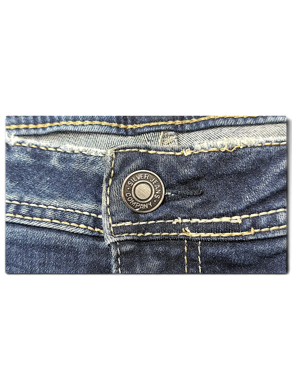 JAKE & IPI Silver Jeans Co. Elyse slim boot jeans featuring blue denim fabric with contrast tan stitching details.