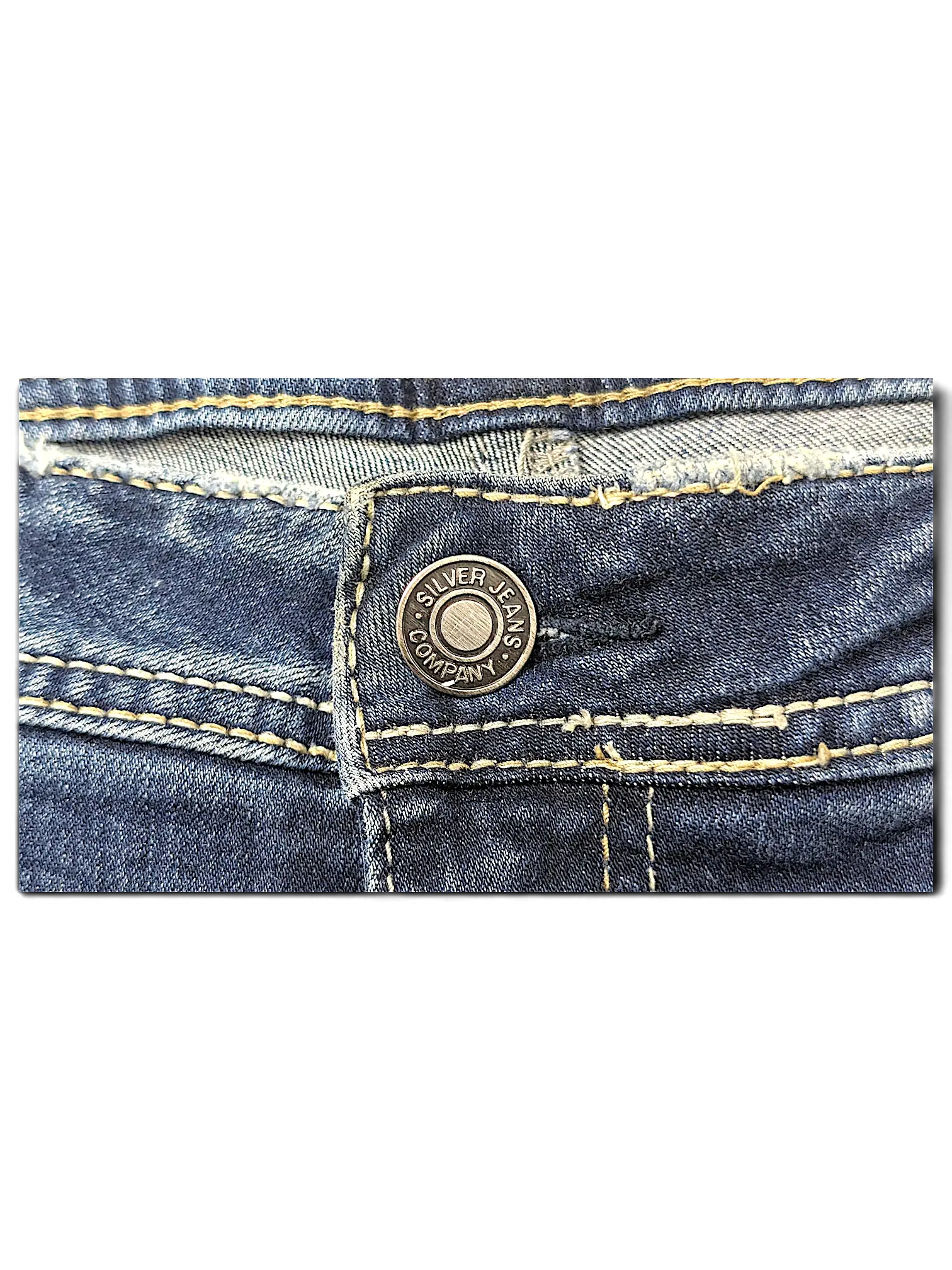 JAKE & IPI Silver Jeans Co. Elyse slim boot jeans featuring blue denim fabric with contrast tan stitching details.