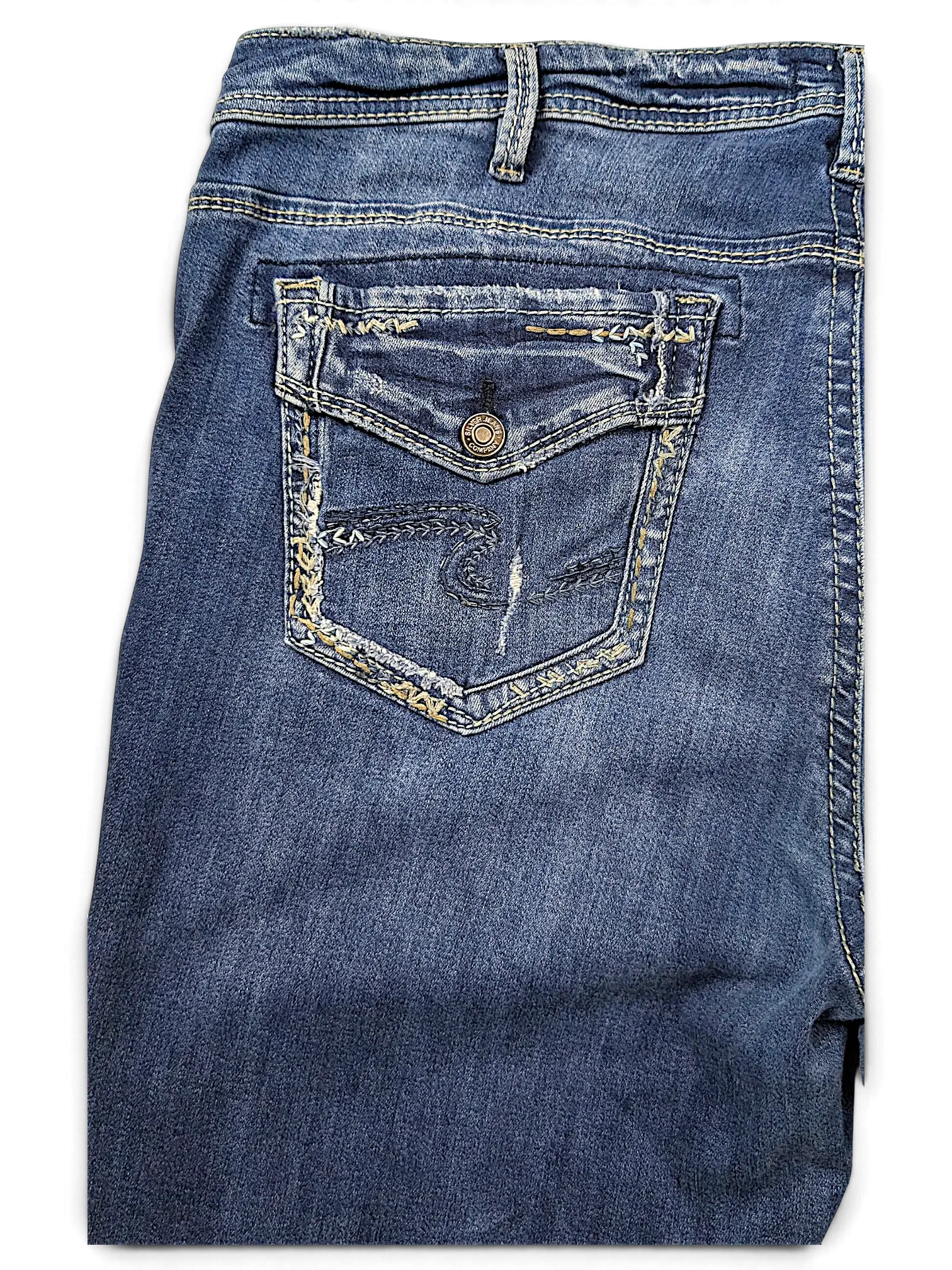 JAKE & IPI Silver Jeans Co. Elyse slim boot jeans featuring a distressed blue denim back pocket with button flap