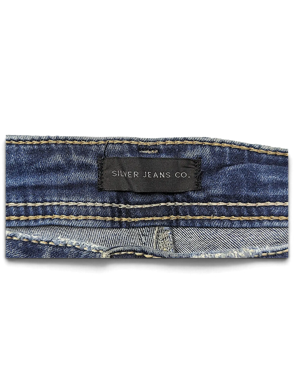 JAKE & IPI Silver Jeans Co. Elyse slim boot jeans featuring a black brand label on blue denim with contrast stitching