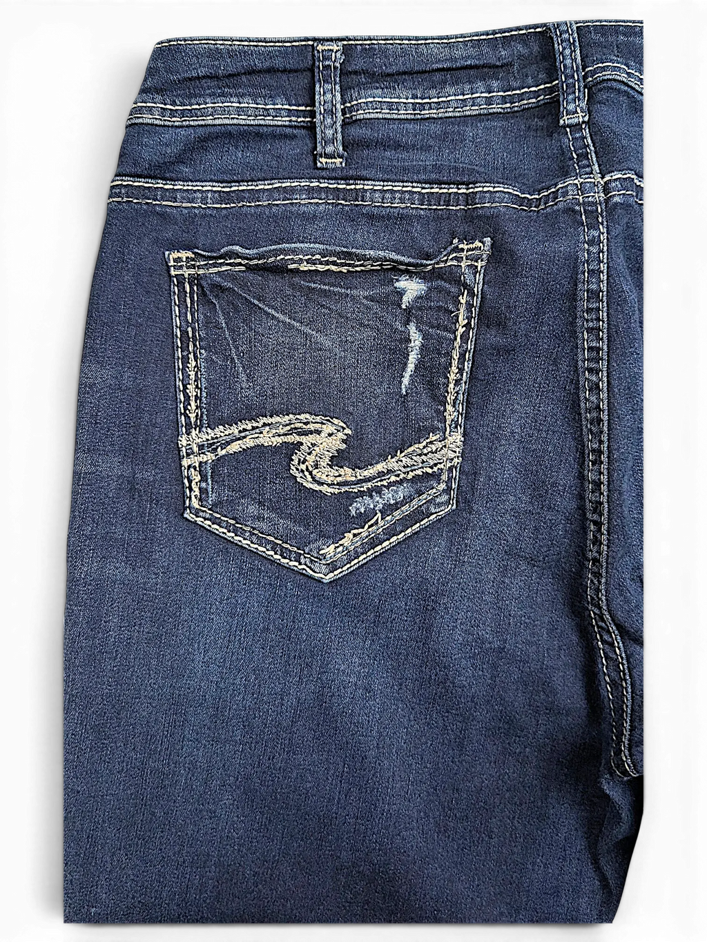 JAKE & IPI Silver Jeans Co. Suki Capri dark wash denim with distressed back pocket and signature embroidery