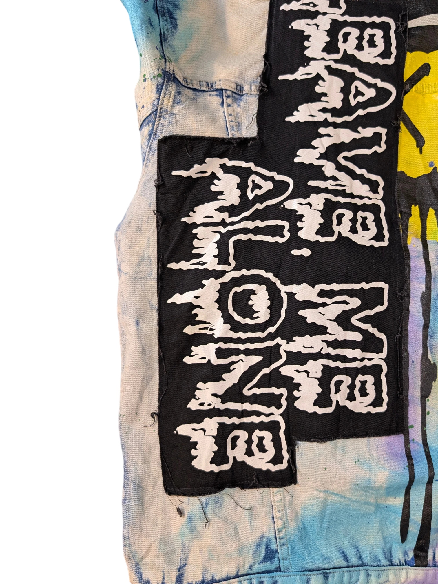 JAKE & IPI Smoke Rise denim jacket with tie-dye and graphic patches.