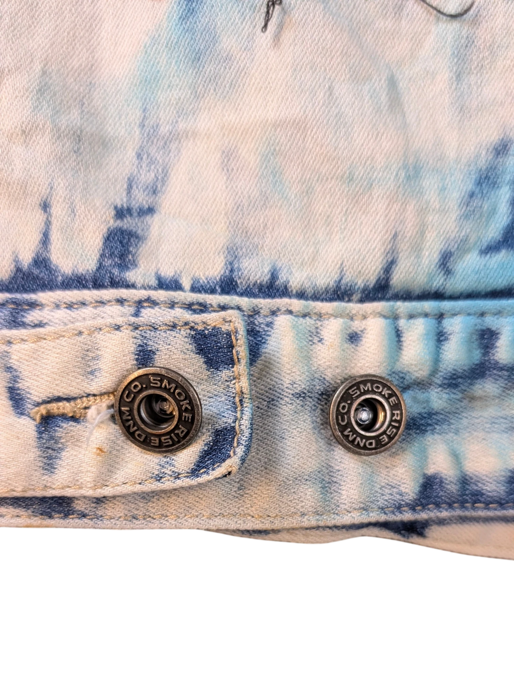 JAKE & IPI Smoke Rise denim jacket with blue and white tie-dye wash and branded metal buttons.