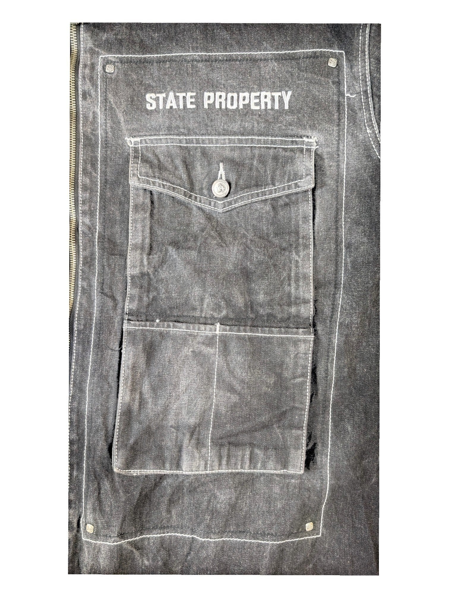 JAKE & IPI State Property dark grey denim jacket with white contrast stitching and button-flap chest pocket.