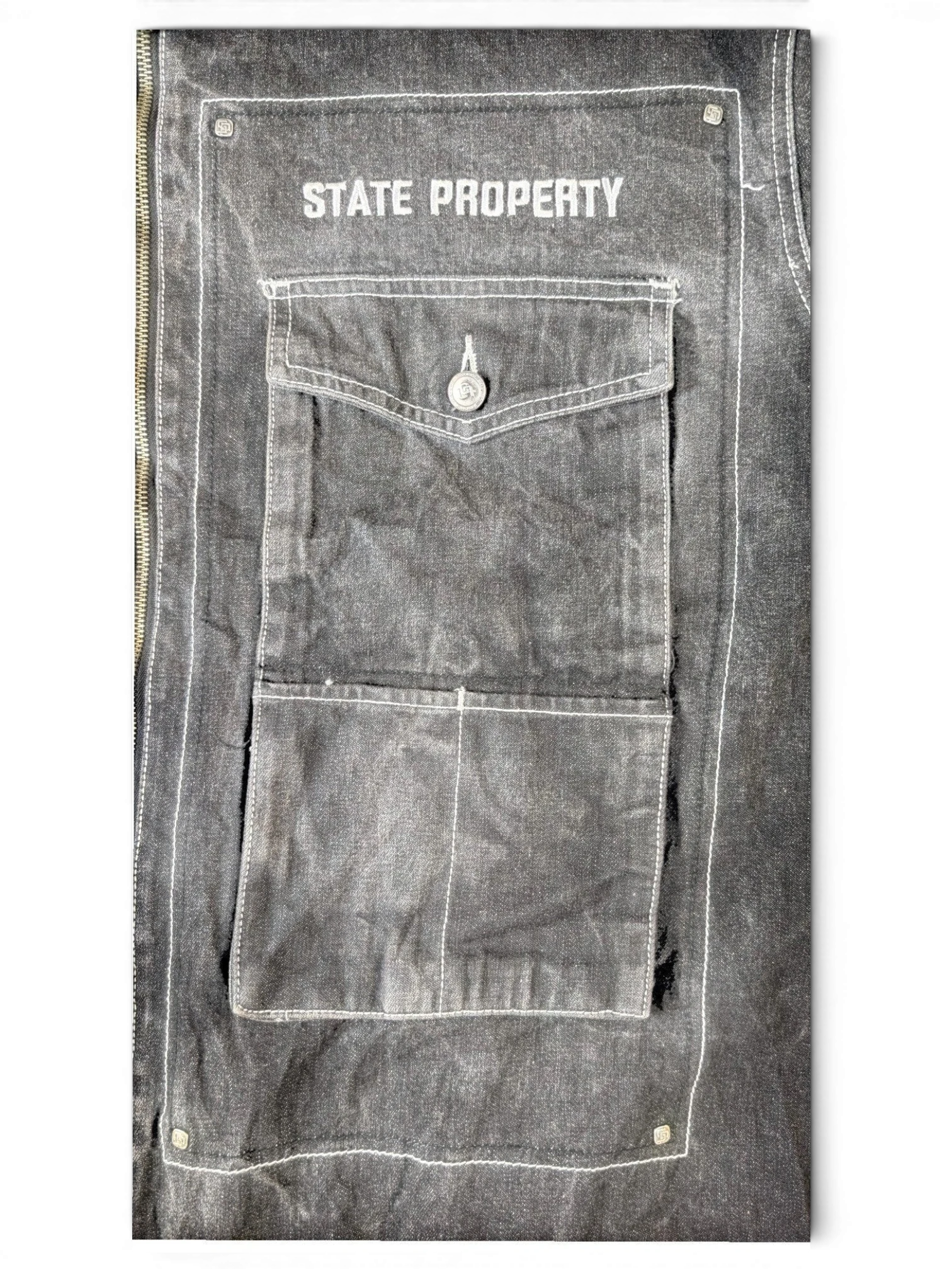JAKE & IPI State Property dark grey denim jacket with white contrast stitching and button-flap chest pocket.