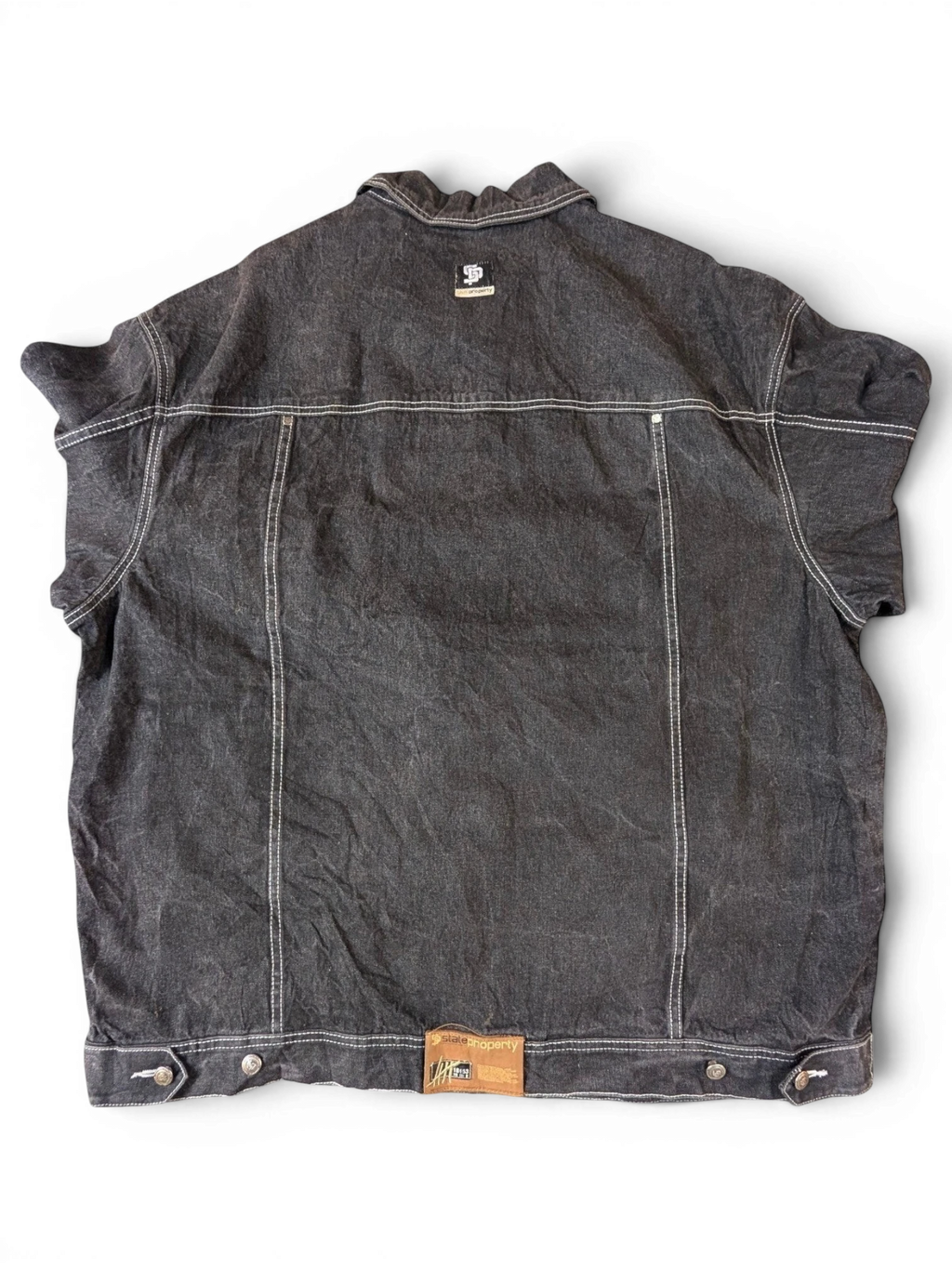 JAKE & IPI State Property dark wash denim jacket with white contrast stitching and a distressed look.