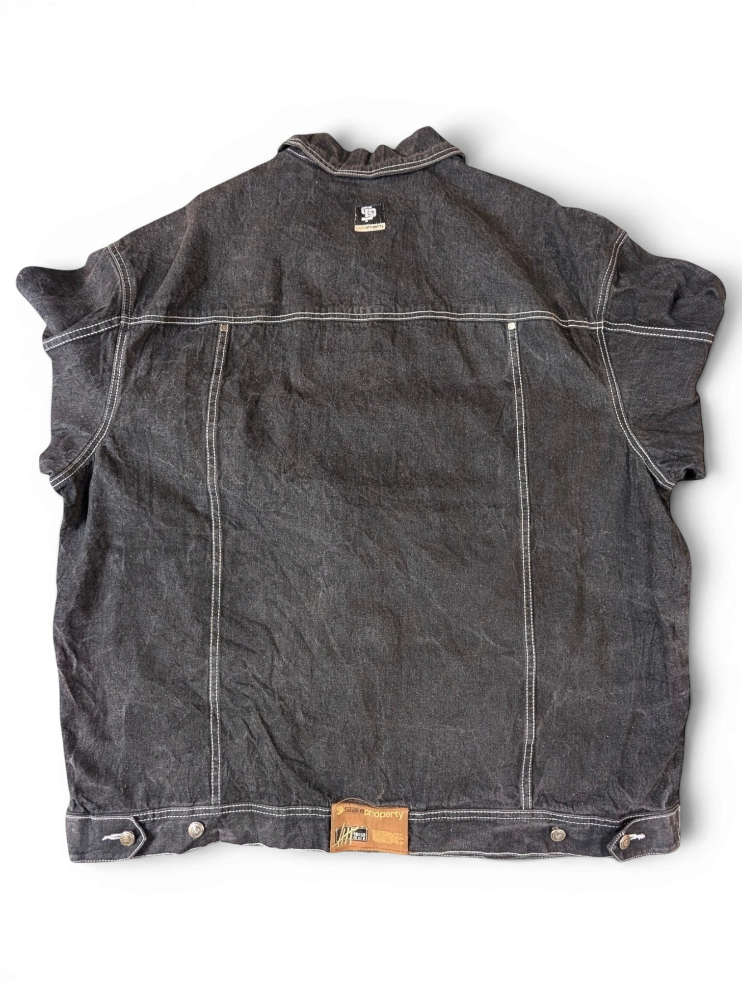 JAKE & IPI State Property dark wash denim jacket with white contrast stitching and a distressed look.