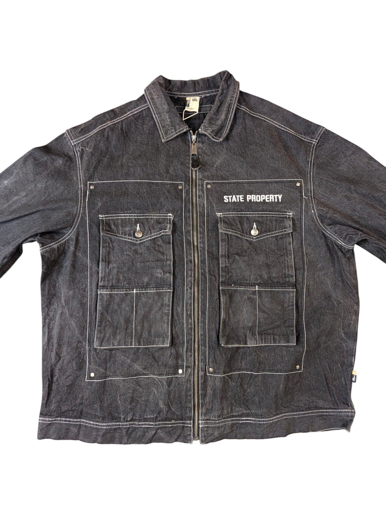 JAKE & IPI State Property dark wash denim jacket with white contrast stitching, zip-up front, and four chest pockets.