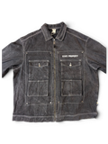 JAKE & IPI State Property dark wash denim jacket with white contrast stitching, zip-up front, and four chest pockets.