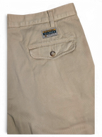 JAKE & IPI Stefanel beige cotton tailored trousers featuring a buttoned back pocket and branded label detail.