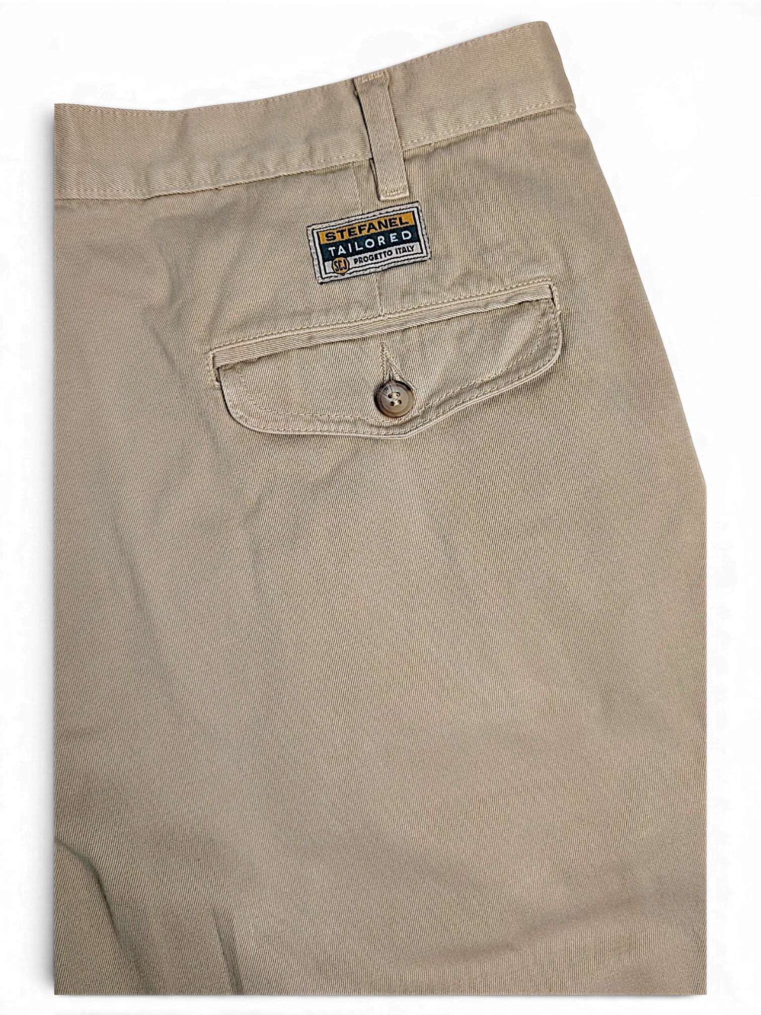 JAKE & IPI Stefanel beige cotton tailored trousers featuring a buttoned back pocket and branded label detail.
