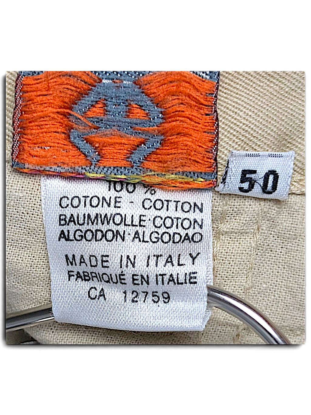 JAKE & IPI Stefanel beige cotton trousers care label showing 100% cotton composition and size 50 tag