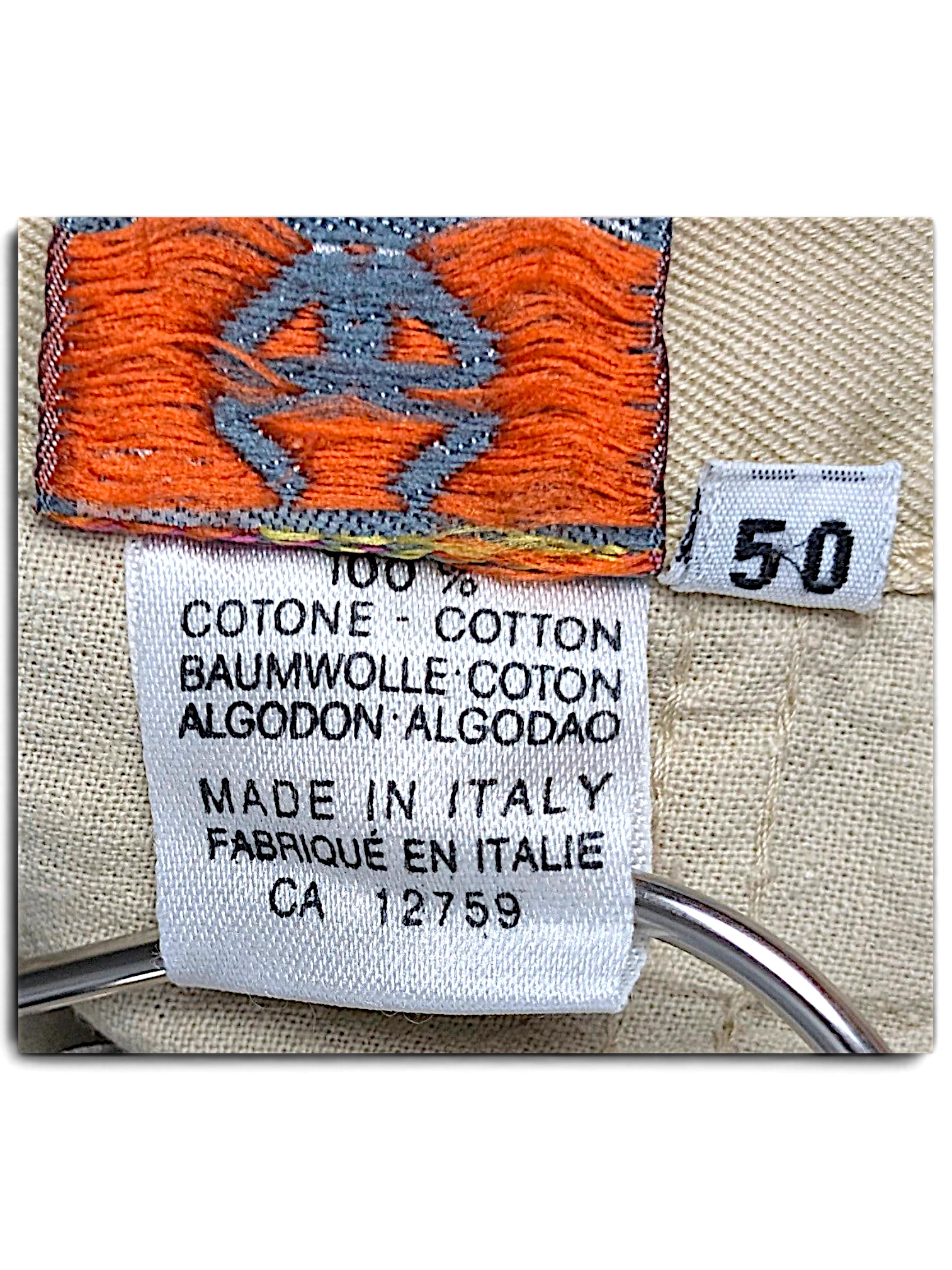 JAKE & IPI Stefanel beige cotton trousers care label showing 100% cotton composition and size 50 tag