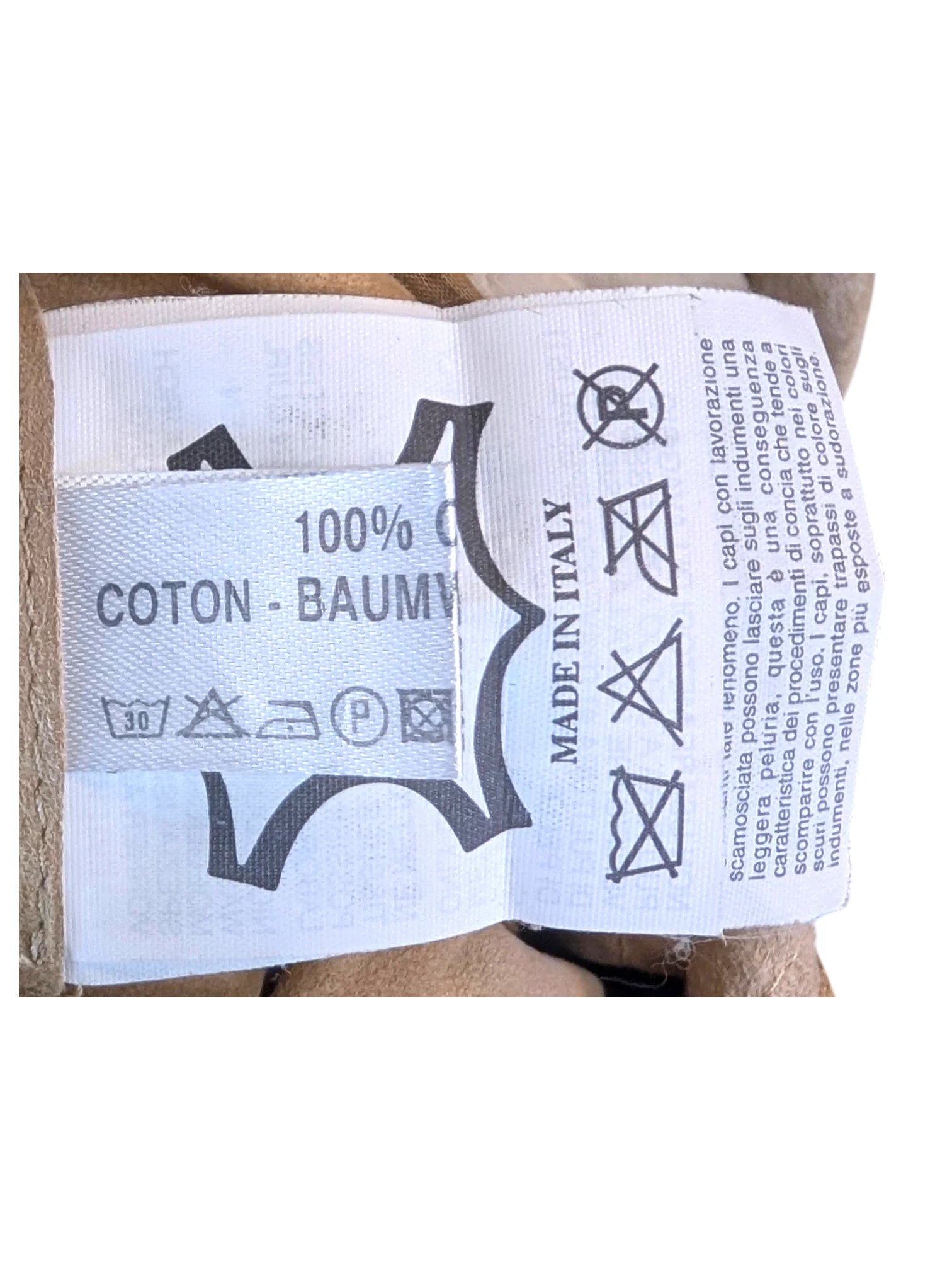 JAKE & IPI suede leather pants interior care label showing 100% cotton lining and Made in Italy origin