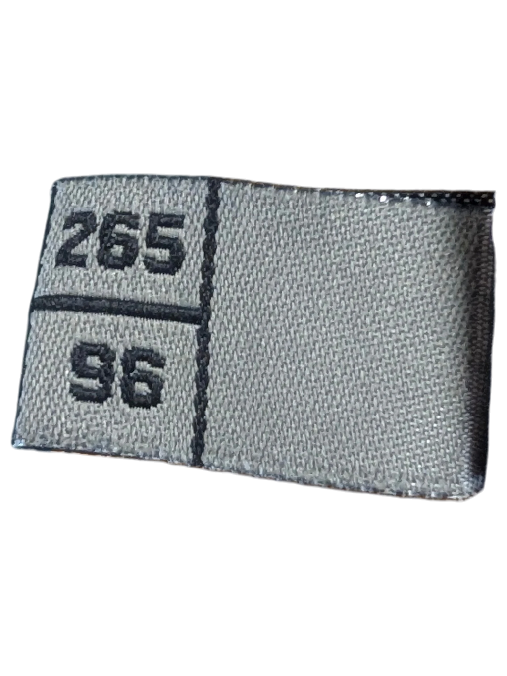 Close-up of JAKE & IPI suede leather pants interior label showing size 265 96 and polyester lining details
