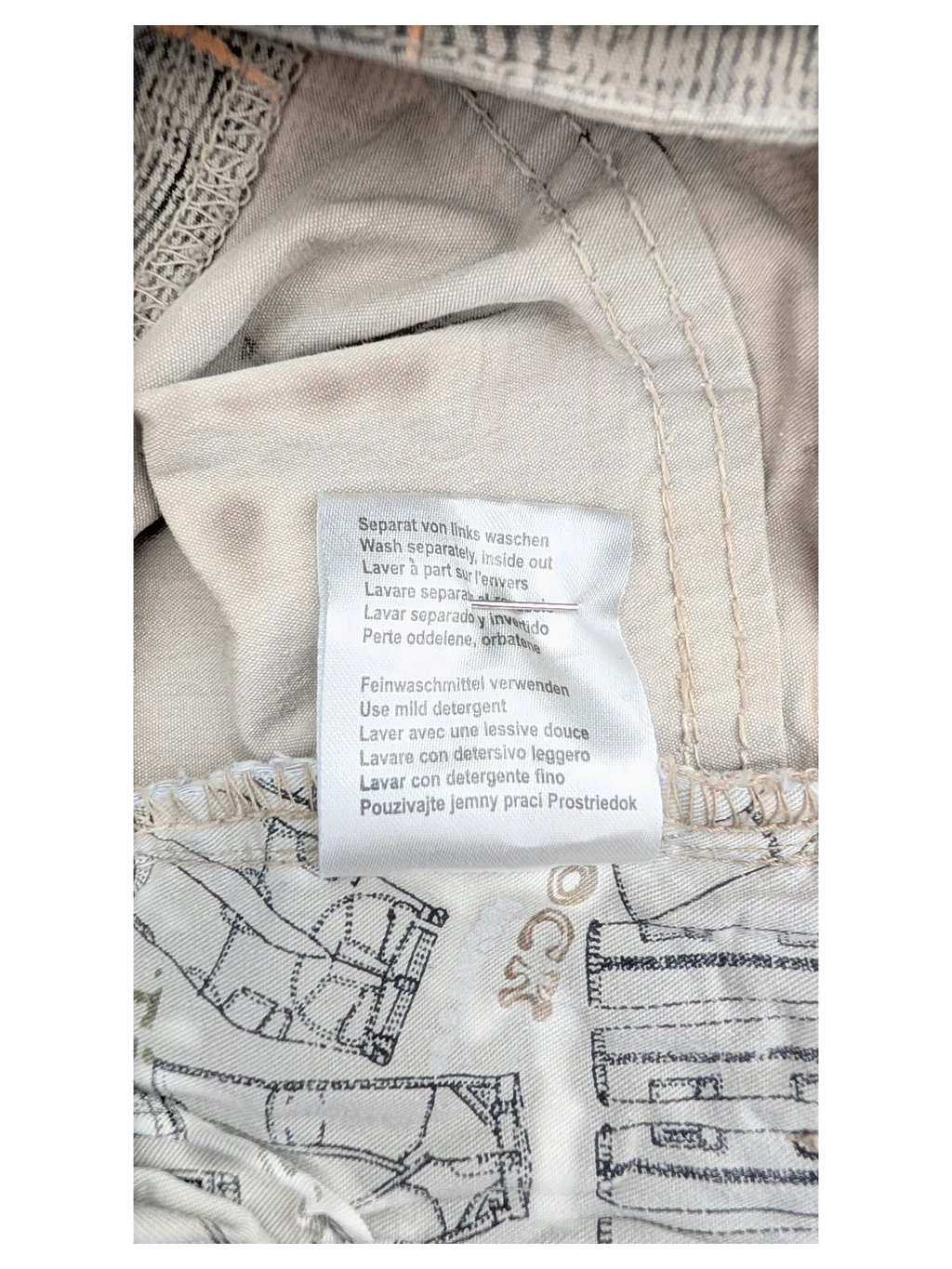 JAKE & IPI Timezone Cargo Pants 27, beige cotton with blueprint pattern lining and care instructions tag.