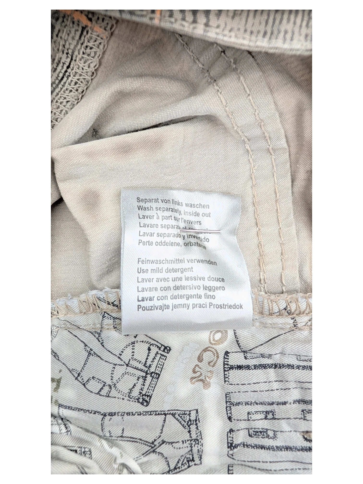 JAKE & IPI Timezone Cargo Pants 27, beige cotton with blueprint pattern lining and care instructions tag.