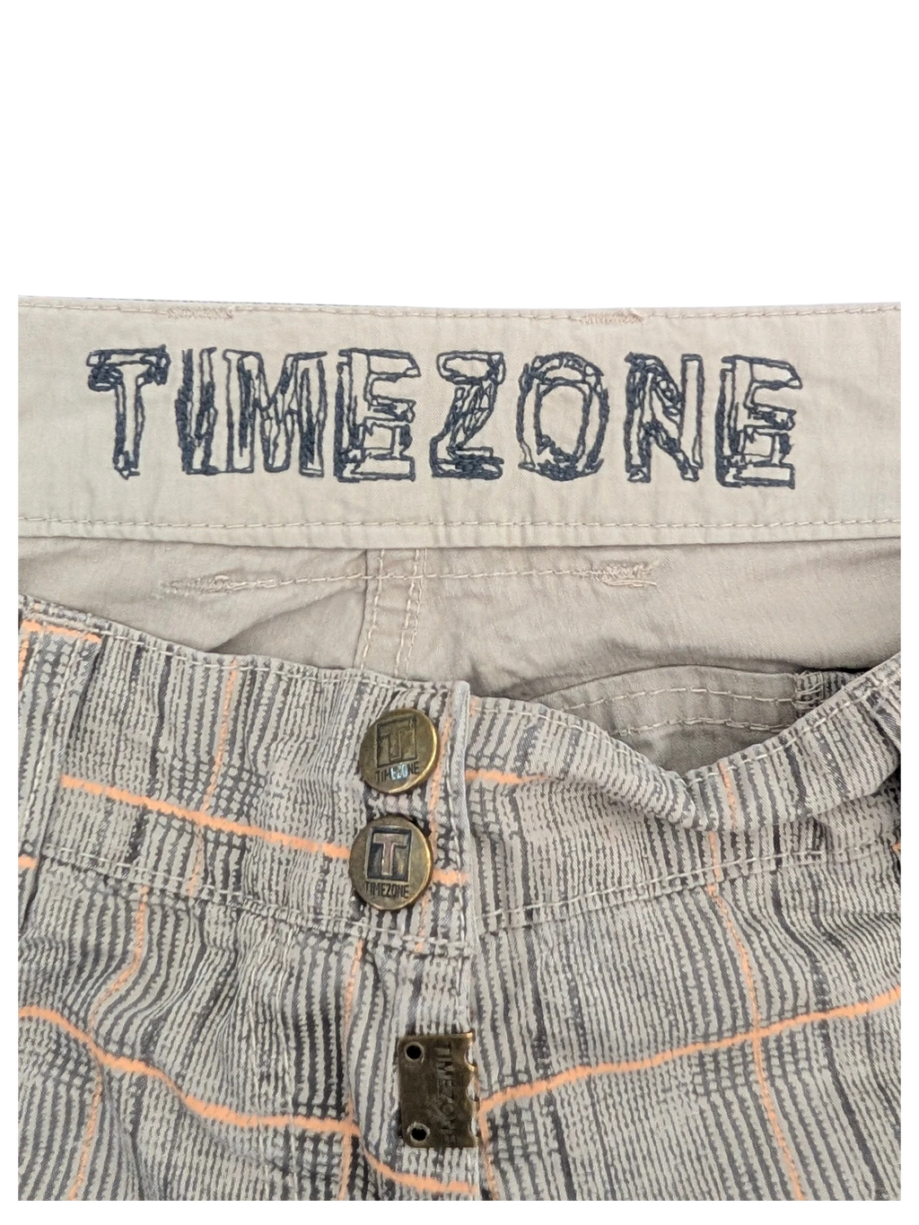 JAKE & IPI Timezone cargo pants in grey with orange plaid pattern. Features button closure and branded details.