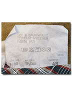 JAKE & IPI Tivoli trousers garment care label showing 100 percent cotton composition and size 48