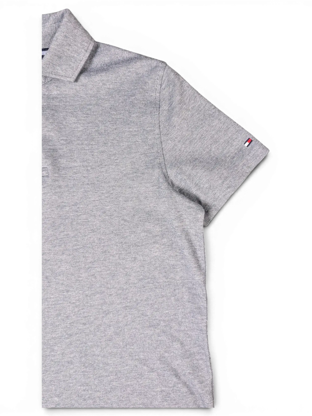 JAKE & IPI pre-owned Tommy Hilfiger grey short-sleeve polo shirt with a classic collar and small logo detail.