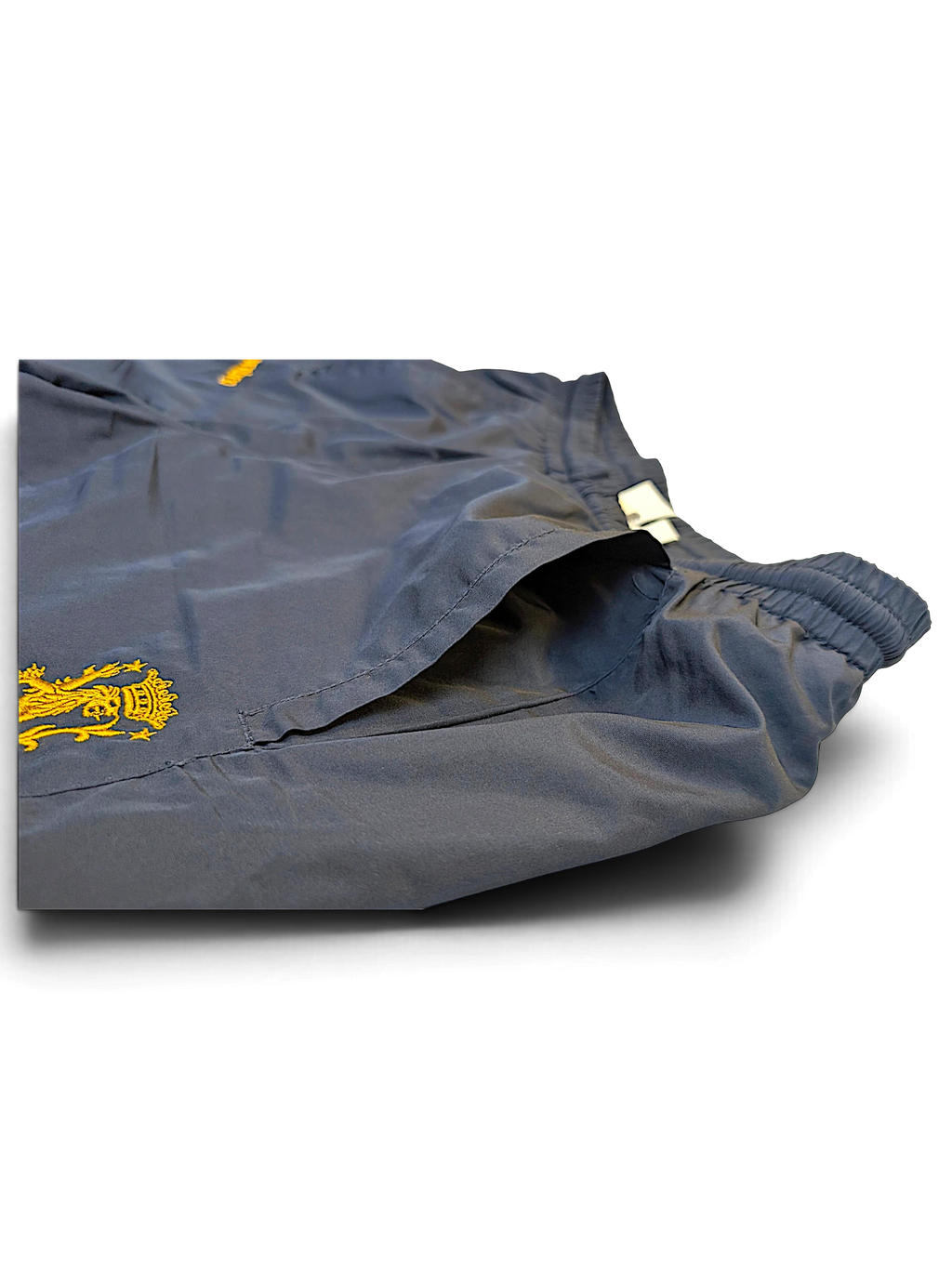 JAKE & IPI Umbro navy track pants with yellow lion graphic detail and elastic waistband