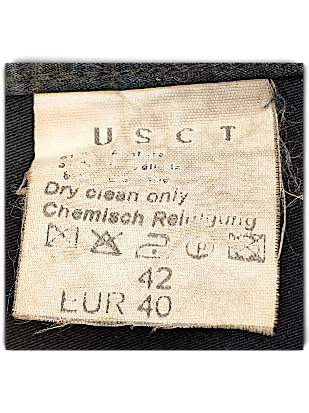 JAKE & IPI USCT black trousers care label showing dry clean instructions and size 40 tag