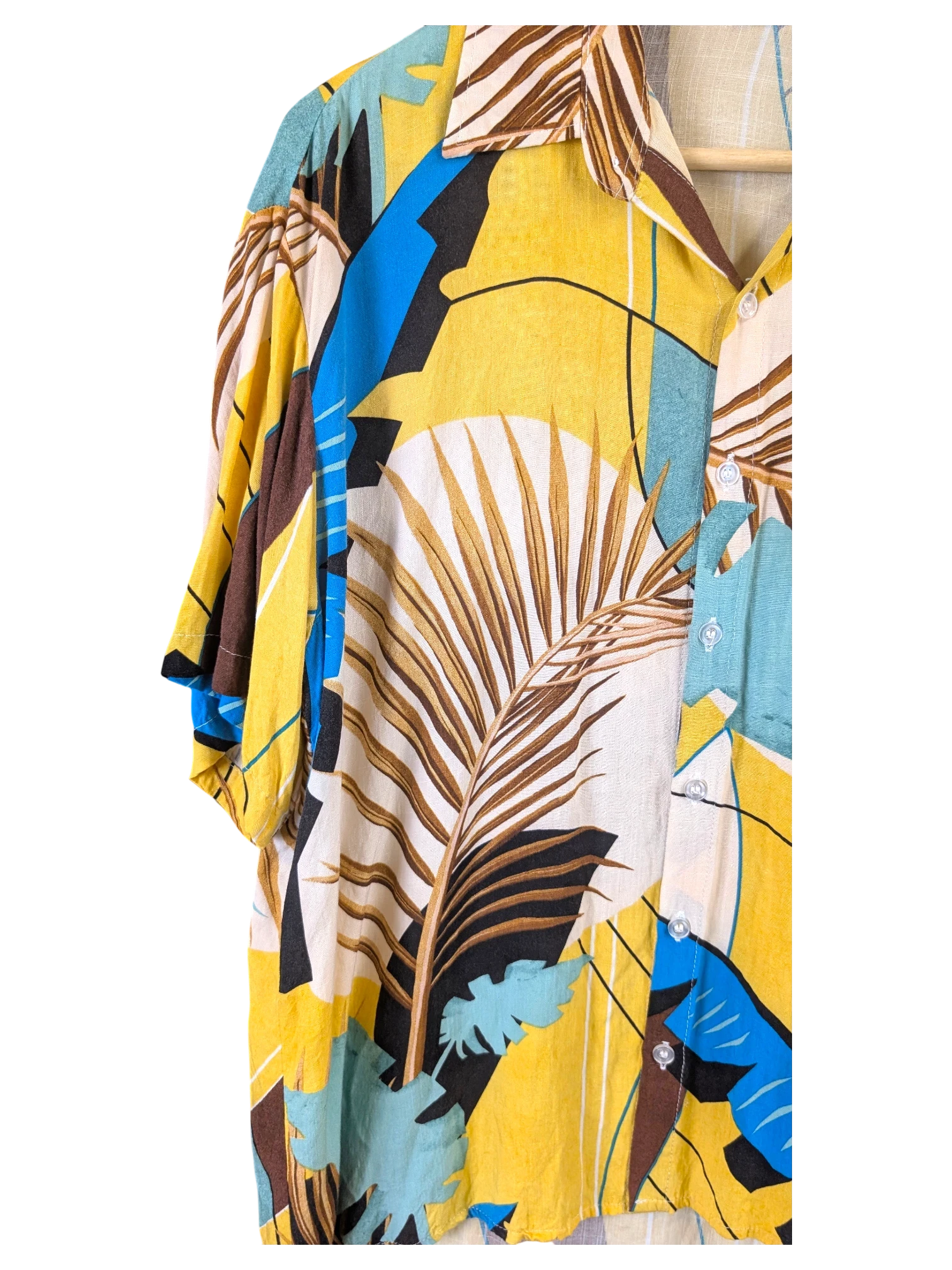 JAKE & IPI Veran Hawaiian shirt featuring a yellow, blue, and brown tropical palm leaf print with a button-down front.