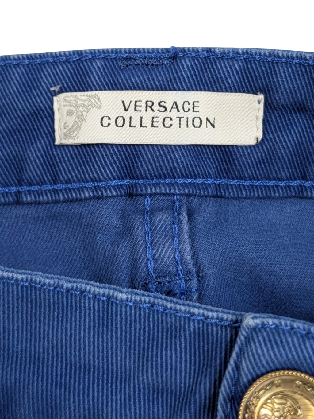 JAKE & IPI vintage Versace Collection royal blue stretch cotton mini skirt with gold Medusa hardware and embroidered back pocket detail.