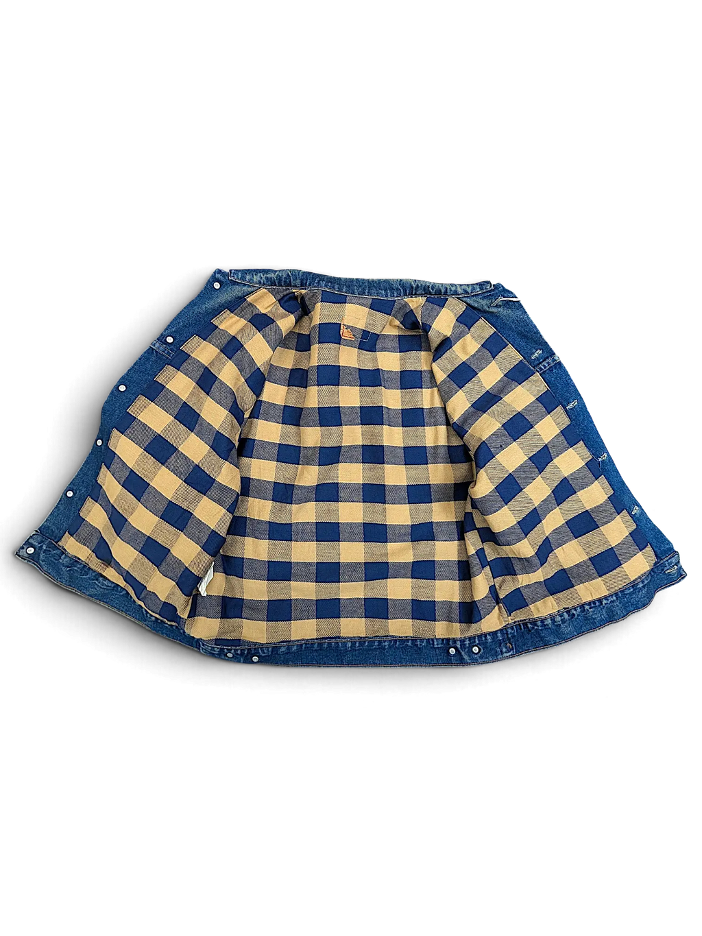 JAKE & IPI vintage Levi's denim jacket featuring a blue and tan plaid flannel lining, shown from the inside.