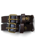 JAKE & IPI Vittozzi double dark brown leather belt with antique brass buckles held in a hand