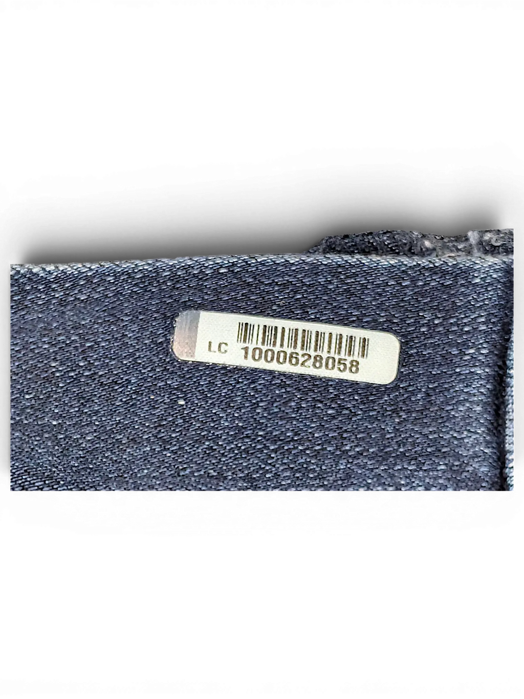 JAKE & IPI Wallflower Plus Long 20 denim fabric detail with a silver barcode authentication label