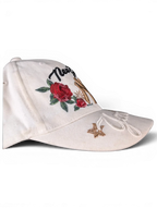 JAKE & IPI white baseball cap featuring New York embroidery, red rose floral details, and gold star accents.