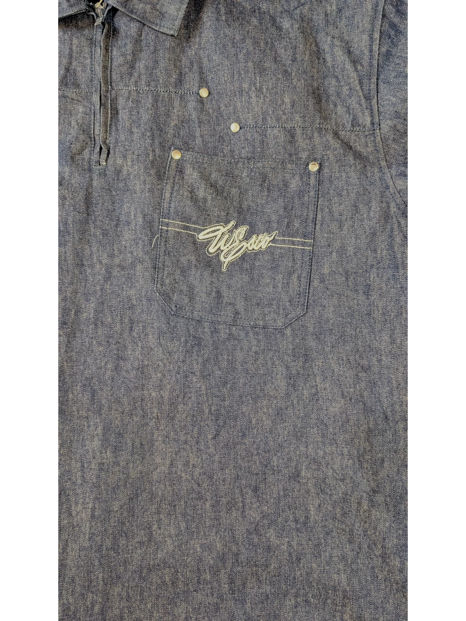 JAKE & IPI Willie Esco denim jacket with embroidered logo on chest pocket. Blue wash, button closure.