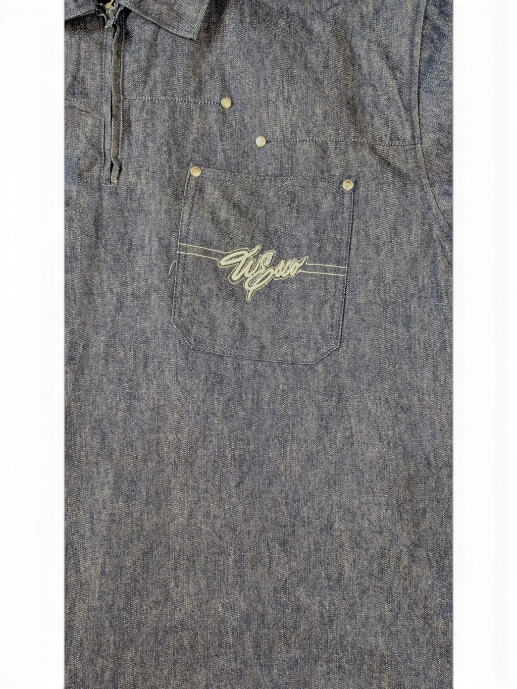 JAKE & IPI Willie Esco denim jacket with embroidered logo on chest pocket. Blue wash, button closure.