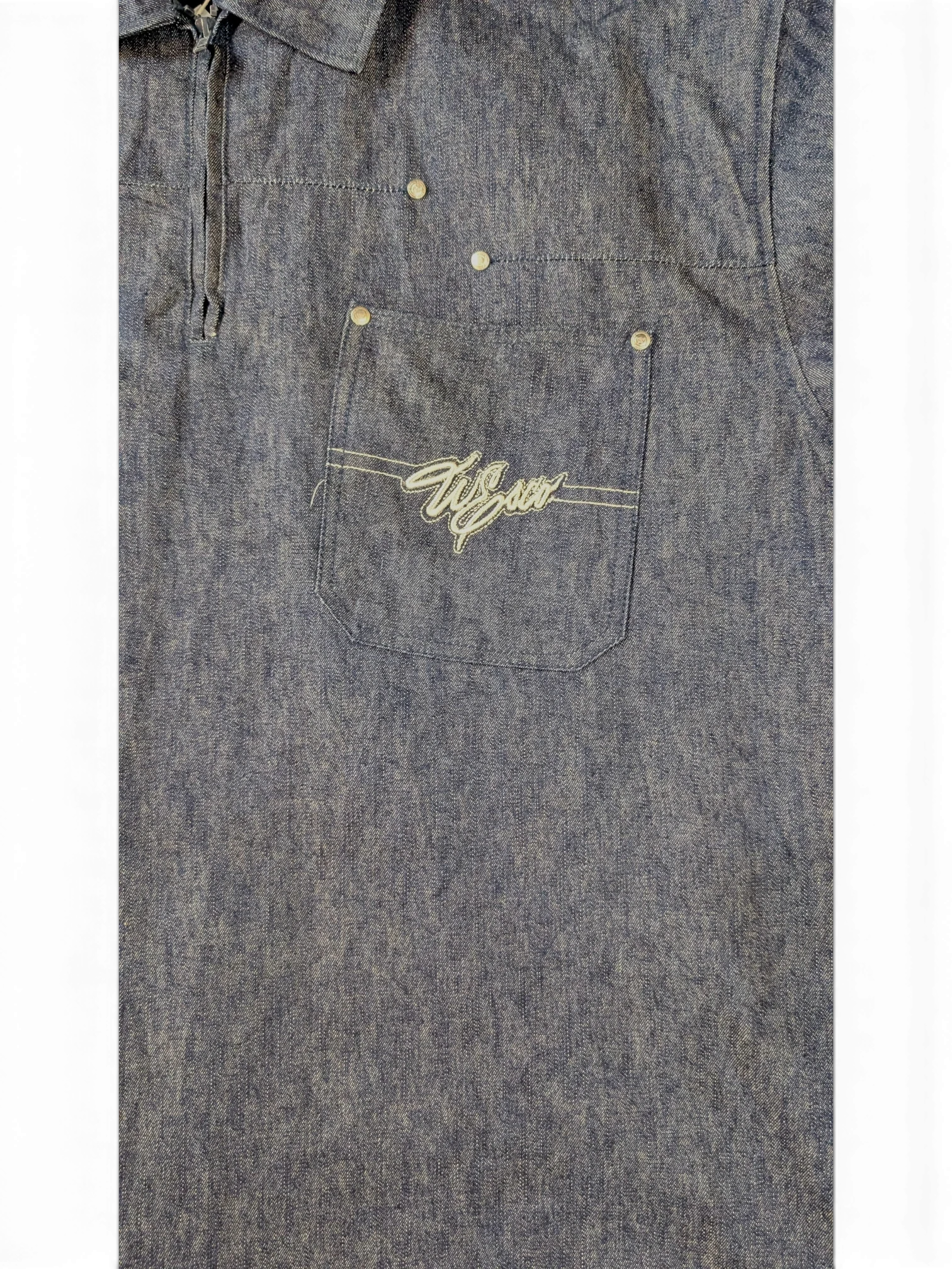 JAKE & IPI Willie Esco denim jacket with embroidered logo on chest pocket. Blue wash, button closure.