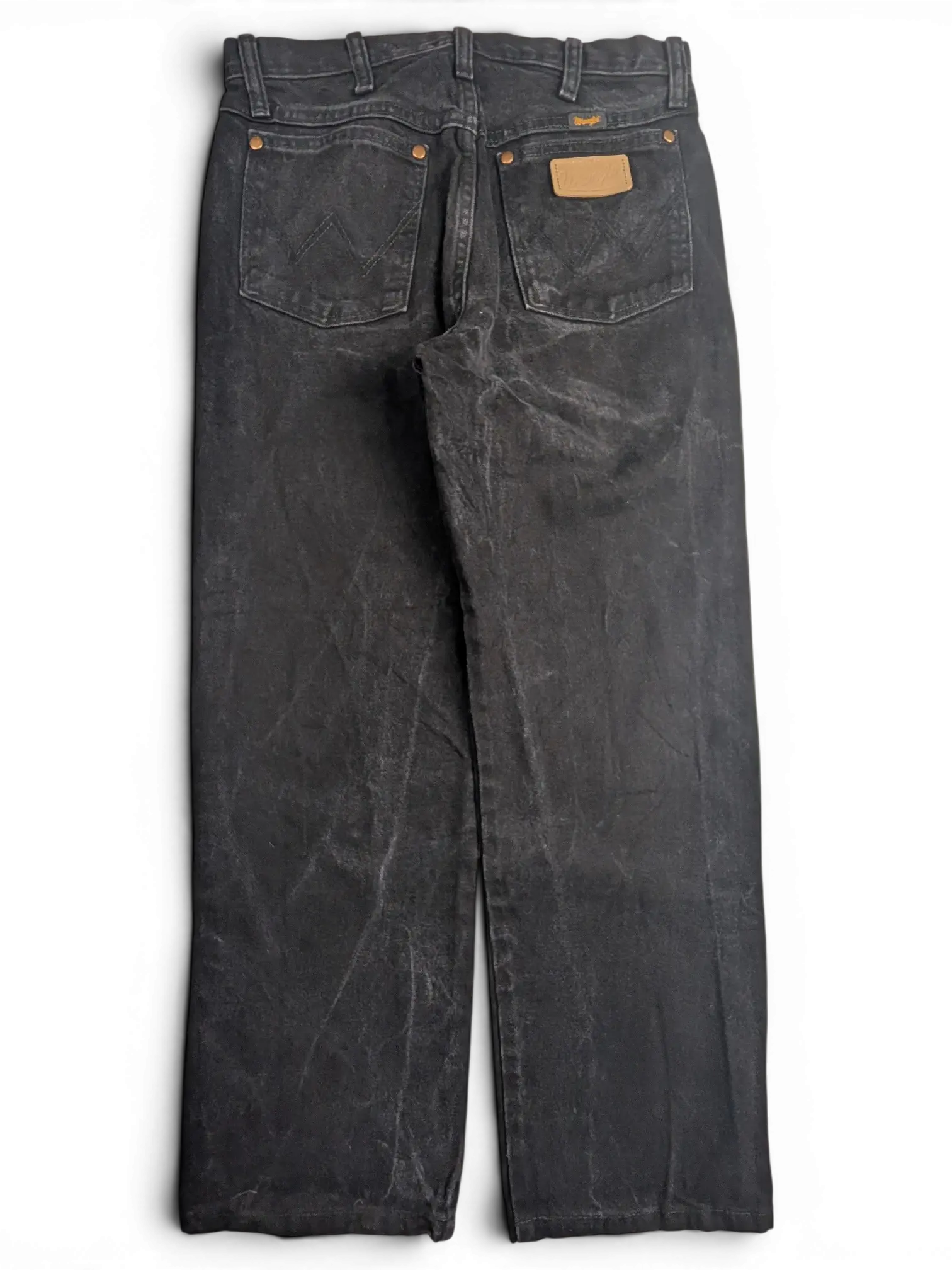 JAKE & IPI Wrangler A203 black denim jeans with a faded wash, back view featuring leather patch and copper rivets.
