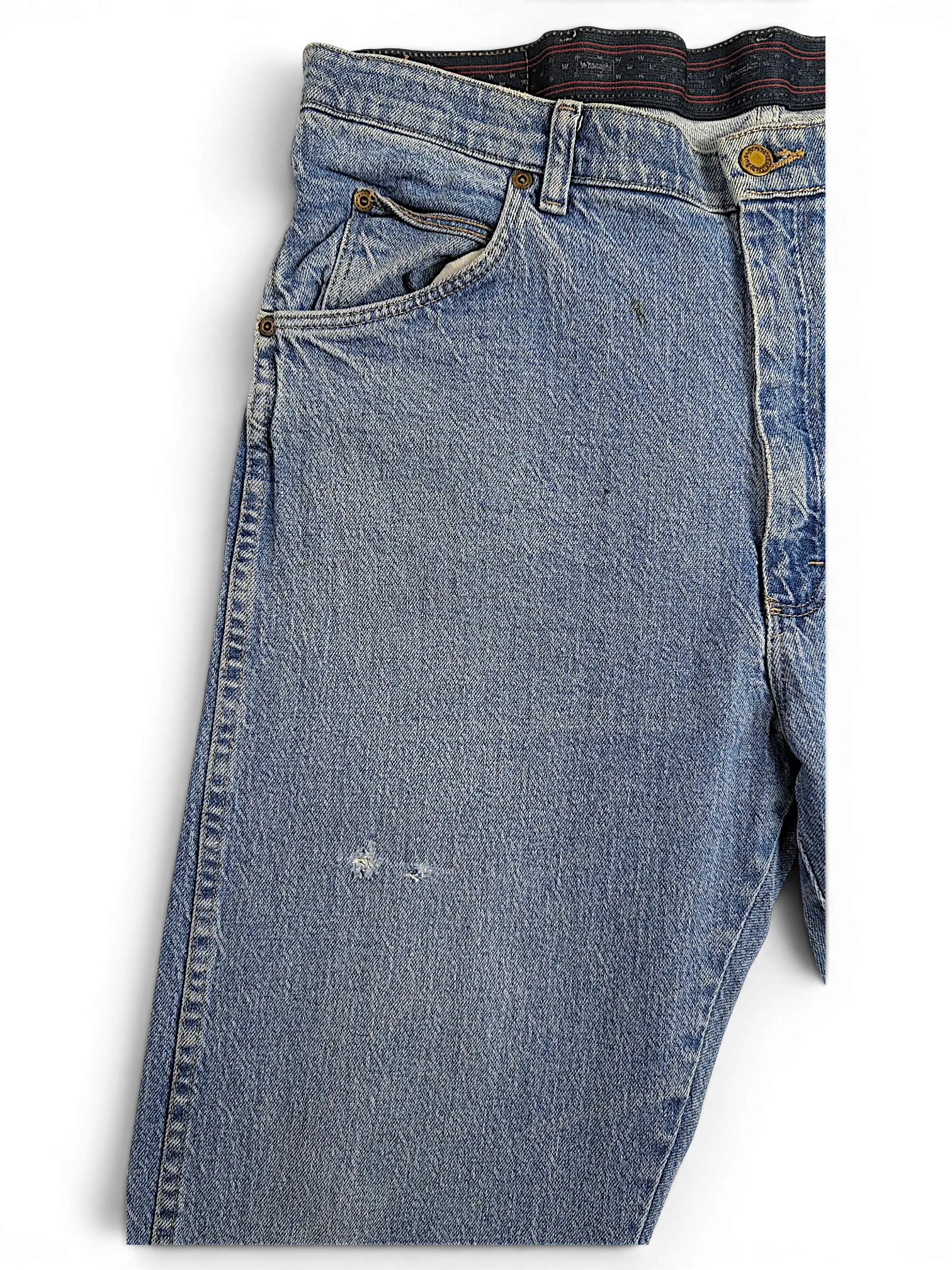 JAKE & IPI Wrangler regular fit blue denim jeans with a distressed finish and classic five-pocket styling