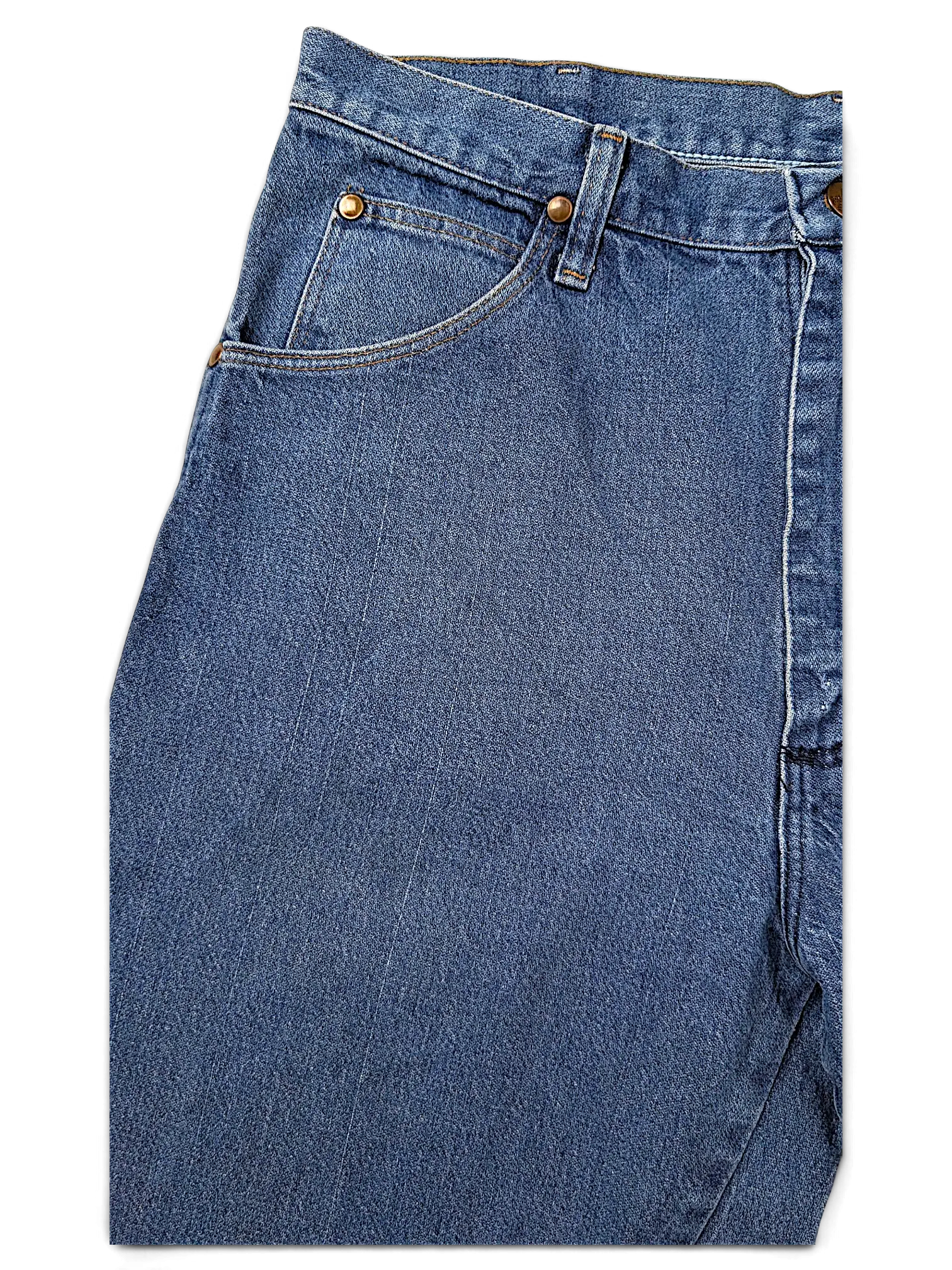 JAKE & IPI Wrangler 31MWZPW blue denim jeans featuring classic copper rivets and a high-waisted fit
