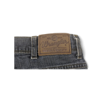 JAKE & IPI Wrangler blue denim jeans featuring a brown leather brand patch on the back waistband