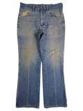 JAKE & IPI vintage Wrangler bootcut jeans in distressed light wash denim with frayed pockets and knee wear