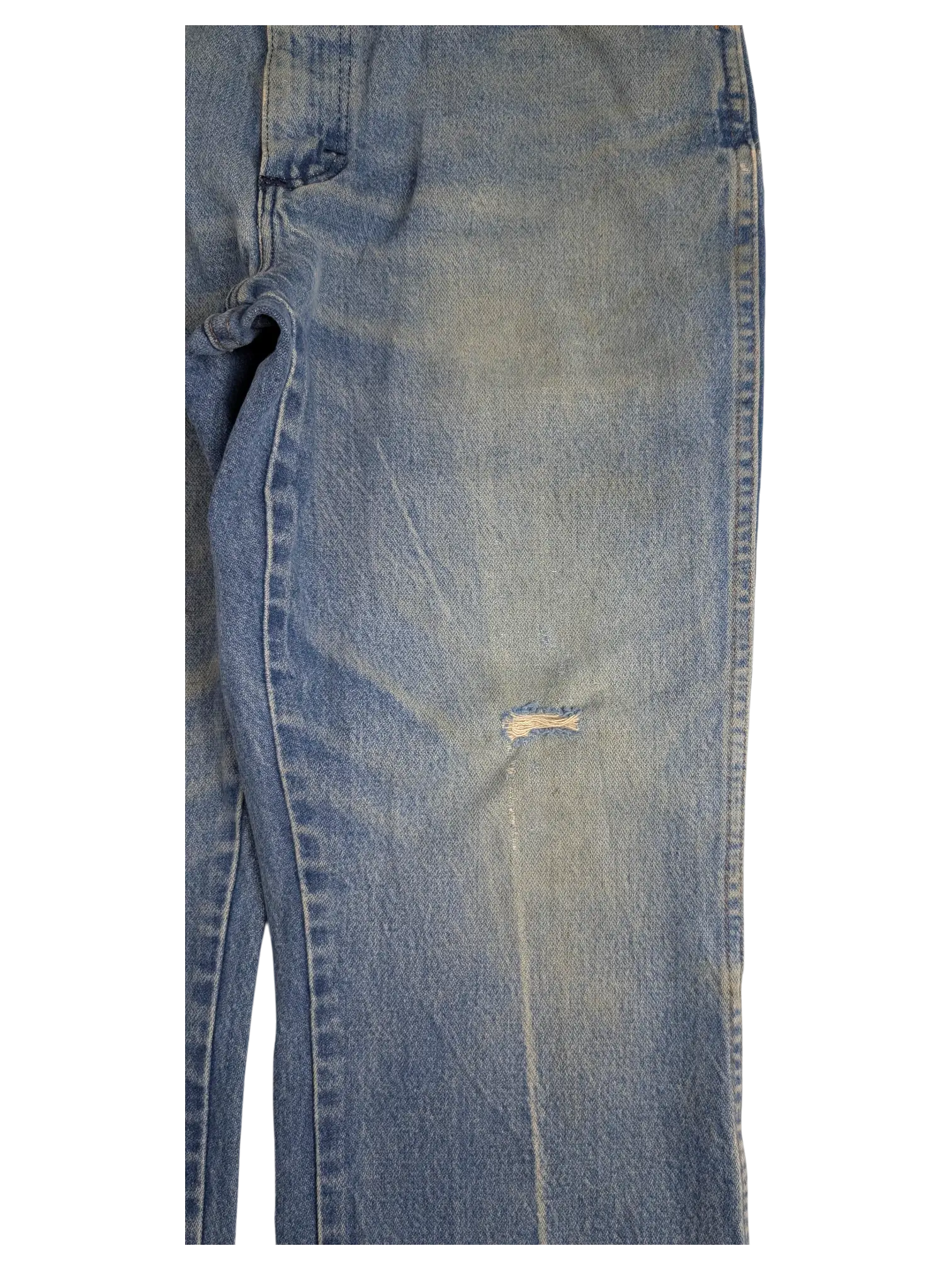 JAKE & IPI vintage light wash Wrangler bootcut jeans with a distressed knee detail on a black background.
