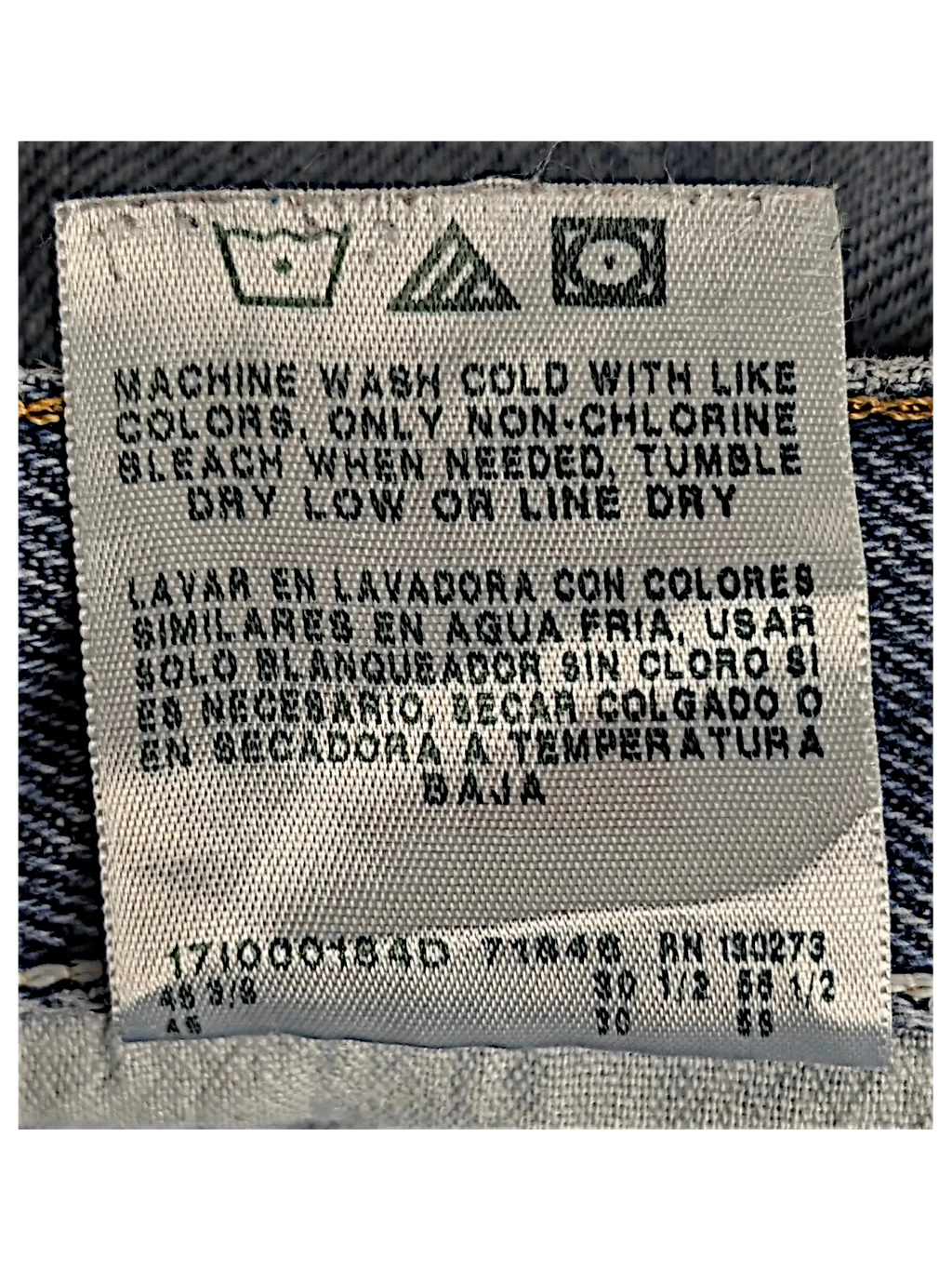 JAKE & IPI Wrangler relaxed fit jeans interior care label with washing instructions in English and Spanish
