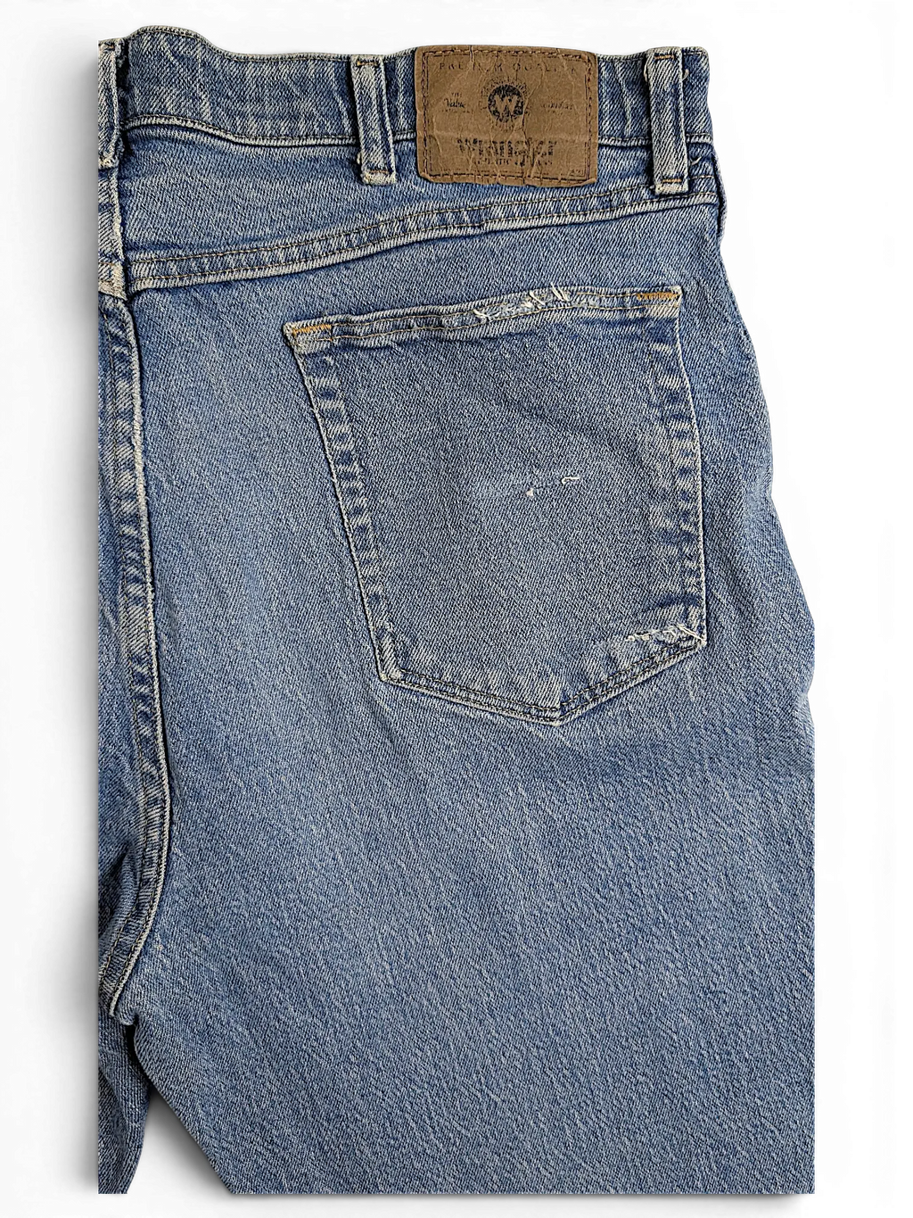JAKE & IPI Wrangler regular fit blue denim jeans featuring a leather back waist patch and classic pocket stitching.