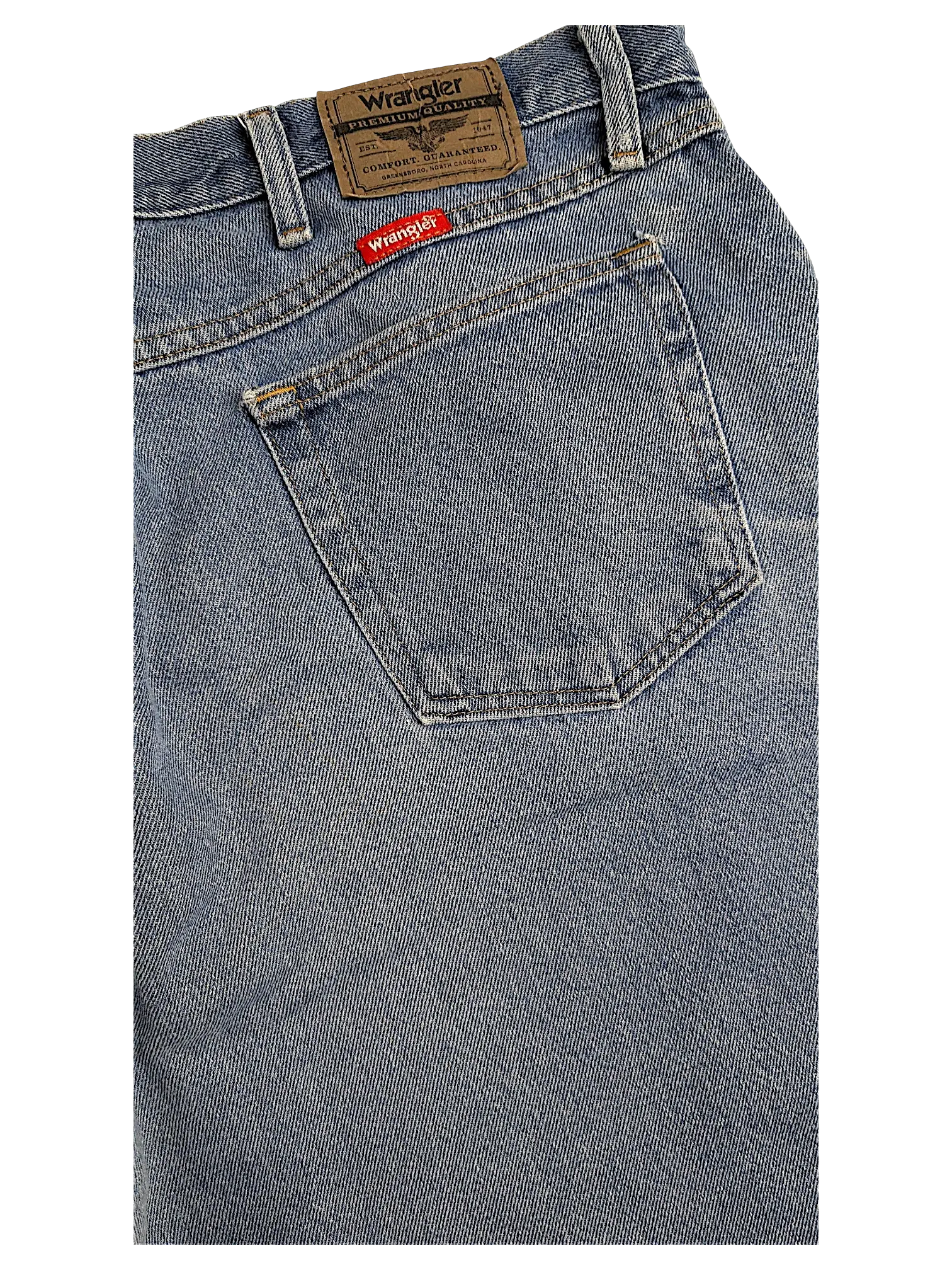 JAKE & IPI Wrangler relaxed fit blue denim jeans featuring a leather brand patch and back pocket detail