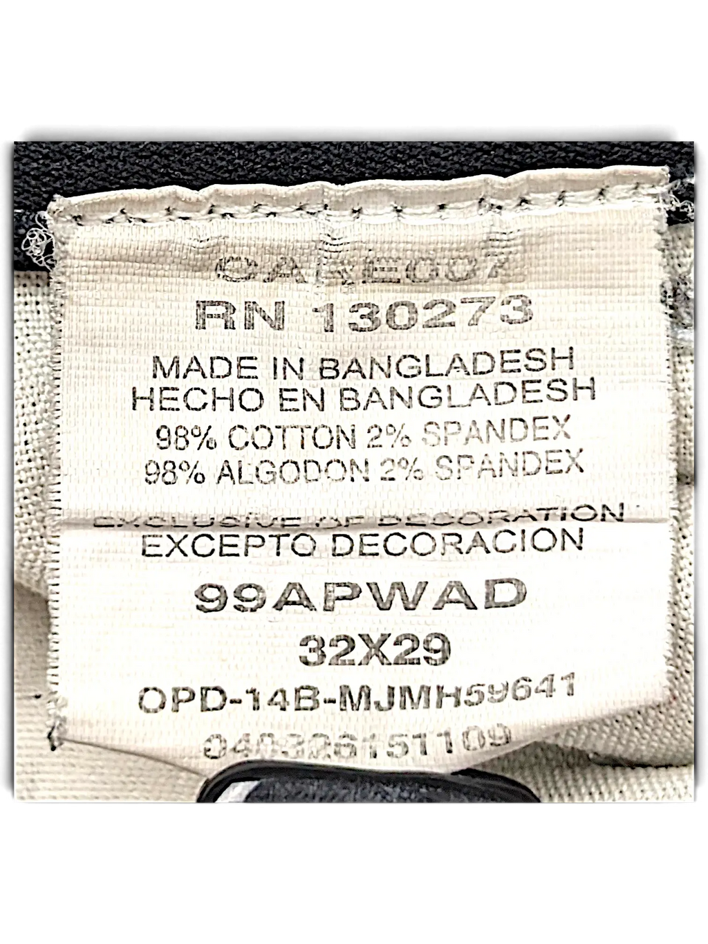 JAKE & IPI Wrangler Riggs Workwear pants care label showing 98 percent cotton and 2 percent spandex material blend