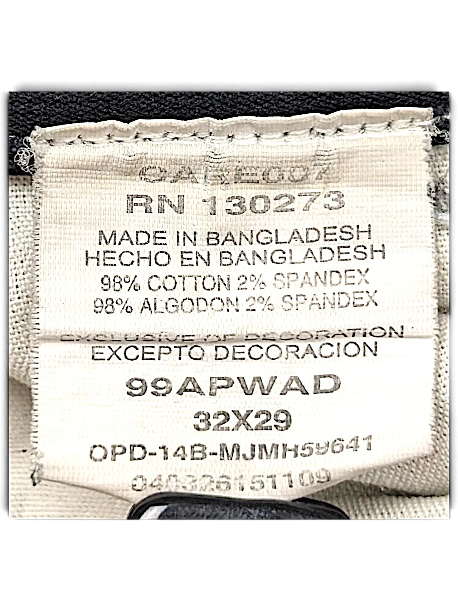 JAKE & IPI Wrangler Riggs Workwear pants care label showing 98 percent cotton and 2 percent spandex material blend