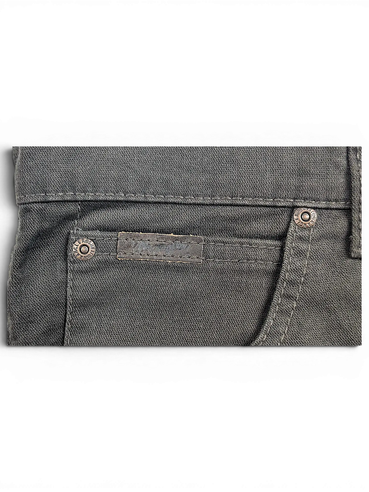 JAKE & IPI Wrangler Texas stretch pants in charcoal grey denim featuring branded metal rivets and a leather patch.