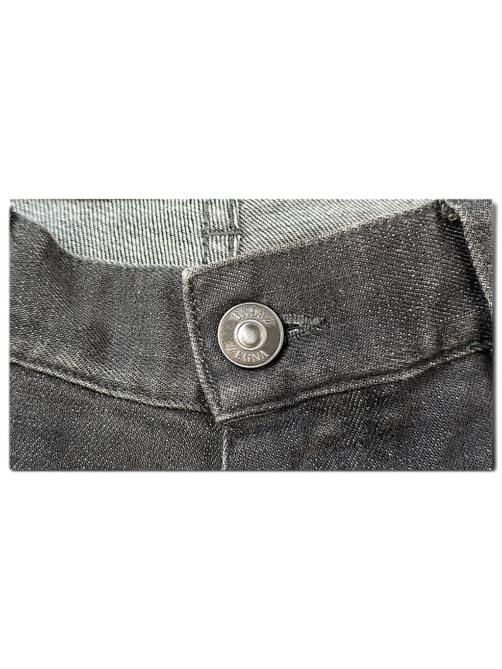 JAKE & IPI IBE Zegna jeans featuring a dark grey denim fabric and a branded silver metal button closure.