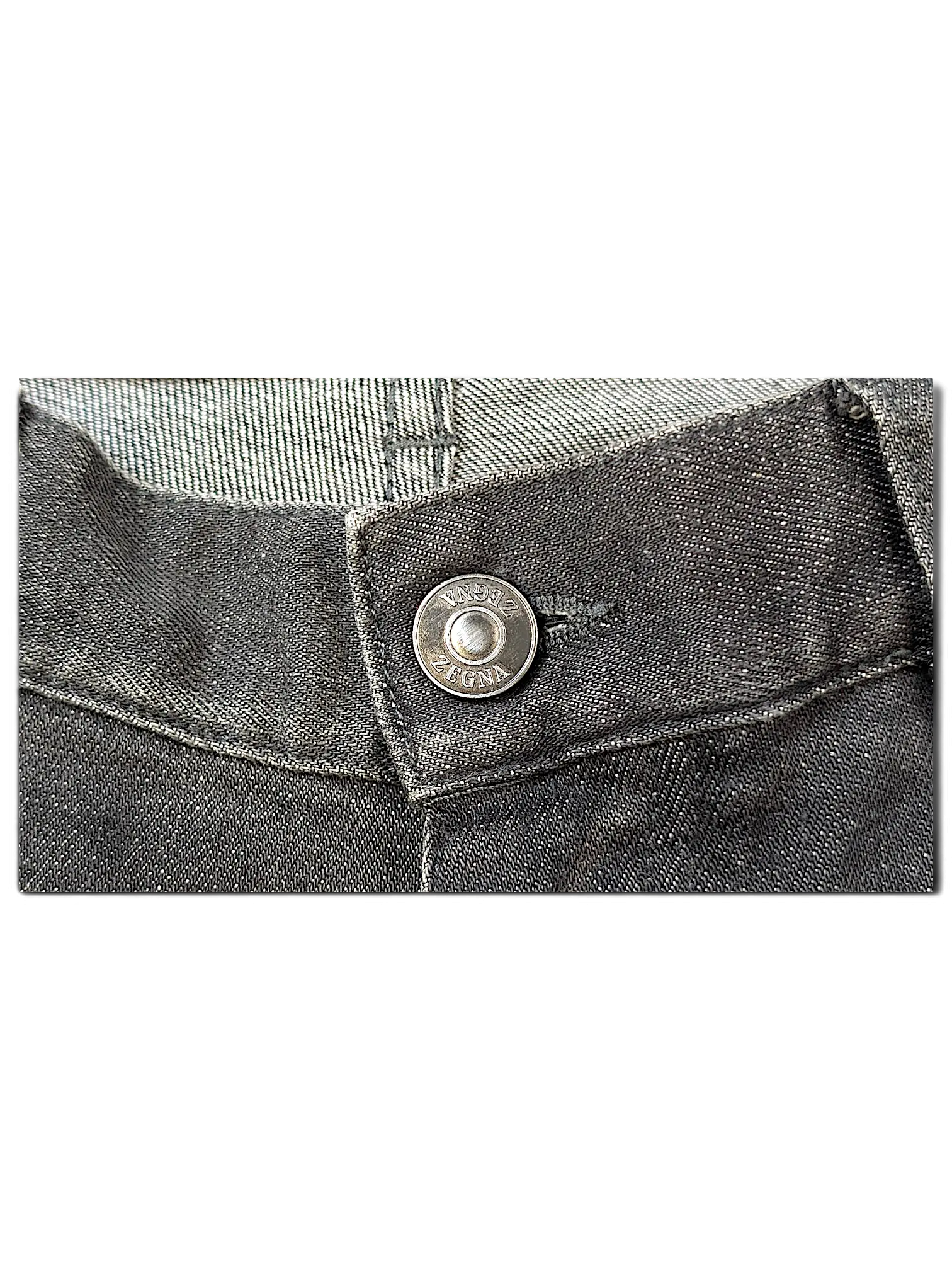 JAKE & IPI IBE Zegna jeans featuring a dark grey denim fabric and a branded silver metal button closure.