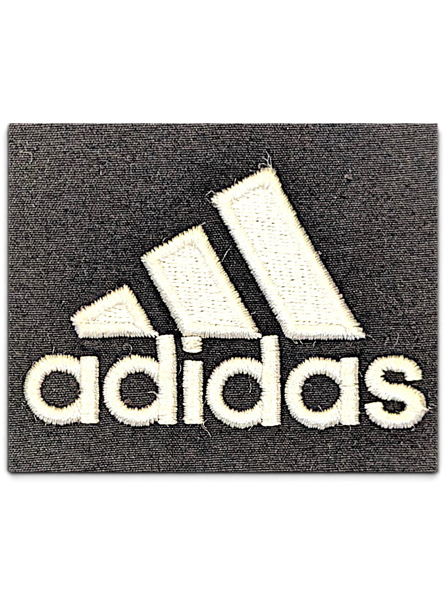 JAKE & IPI pre-owned adidas logo embroidered in white thread on a dark grey fabric background